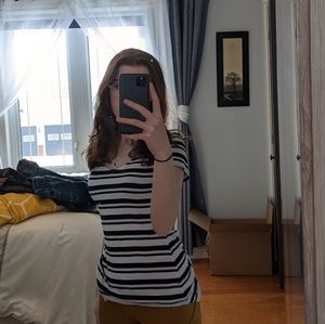 White and navy blue t-shirt in size small